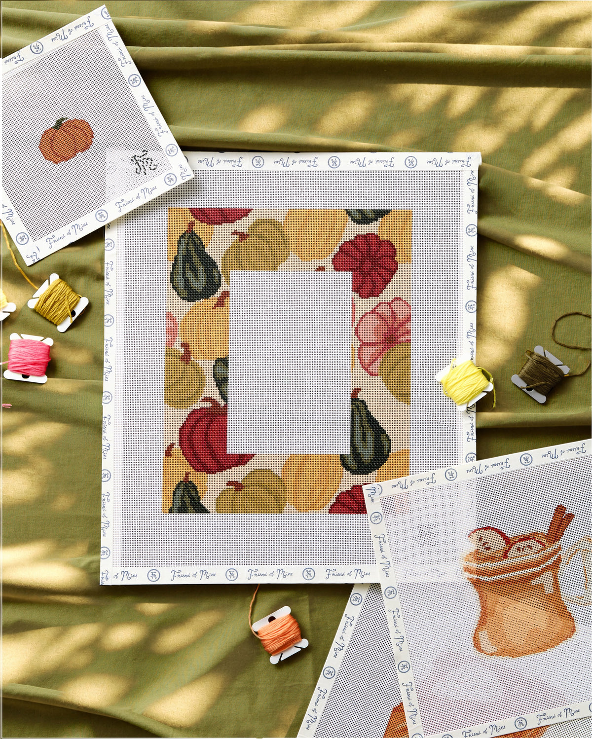 Pumpkin Chic Frame needlepoint canvas styled with threads